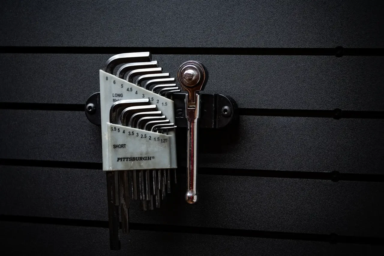 ModWall Hide-A-Mag A set of Allen wrenches and a metallic socket wrench magnetically staged on a BroCo vehicle panel, showcasing how the ModWall Hide-A-Mag keeps essential tools accessible and secure.