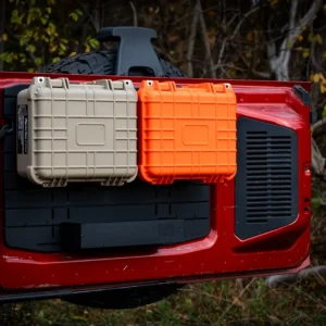 Ford Bronco Tailgate Storage Package The Ford Bronco Tailgate Storage Shelf Package in action, showing a tan and an orange modular case mounted above a large utility shelf for trail gear organization.